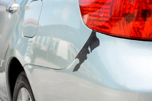 What Causes Paint Peeling off Car and How to Prevent It? Auto Body Shop | Collision Repair Experts – Fix Auto USA paint peeling off a silver car