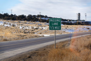 How to Pass a Vehicle Safely? Auto Body Shop | Collision Repair Experts – Fix Auto USA Passing Lane Sign At The Grassy Side Of Road Against Snowy Hill